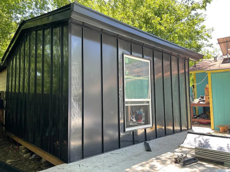 Black standing seam metal wall panels for Roof Inspection in Sanger